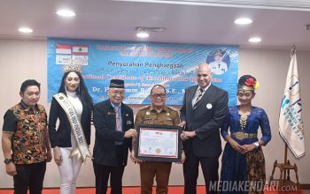 Pj Bupati Harmin Ramba Dianugerahi International Certificate of Excellence and Recognition